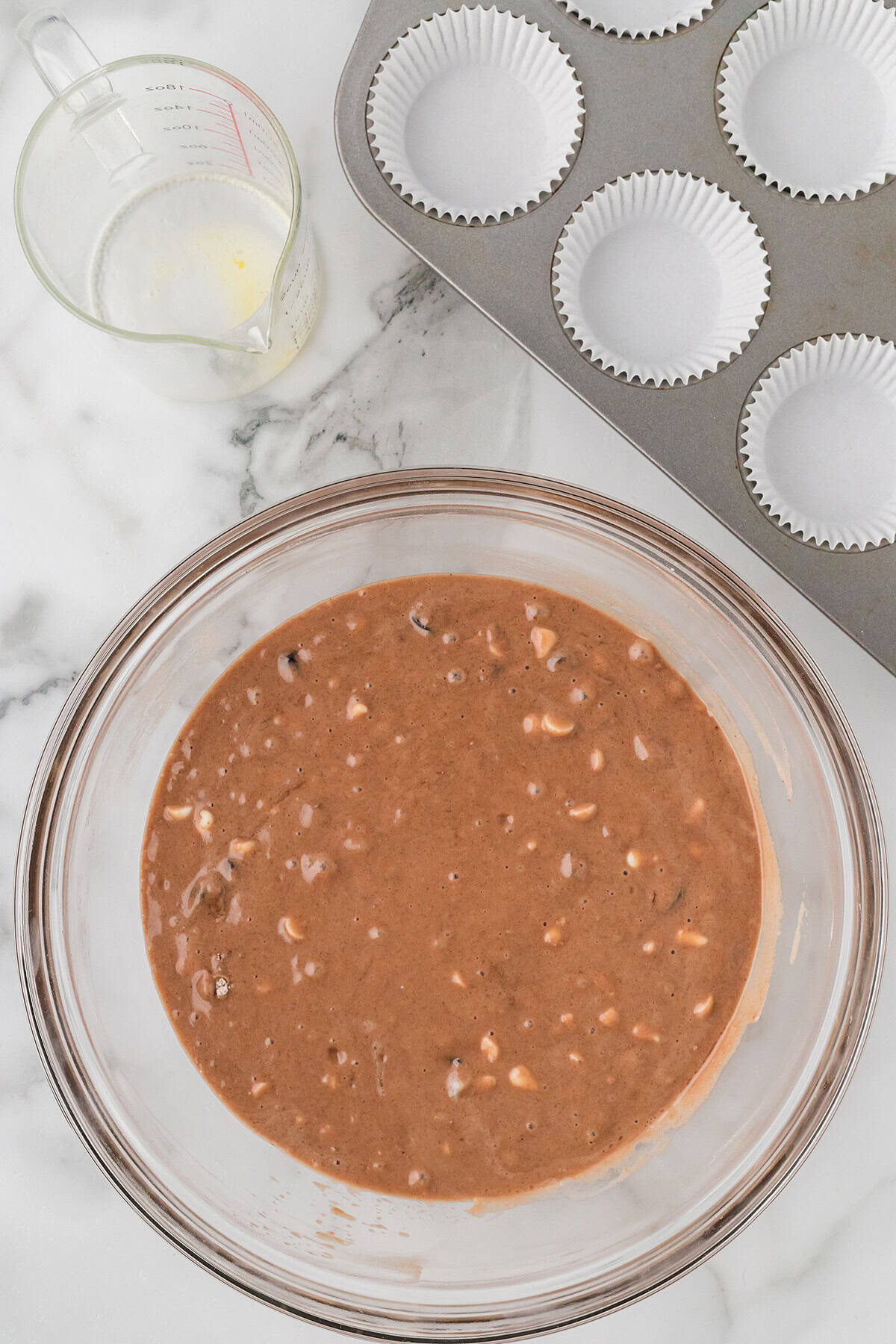 Wet and dry ingredients mixed in a bowl.