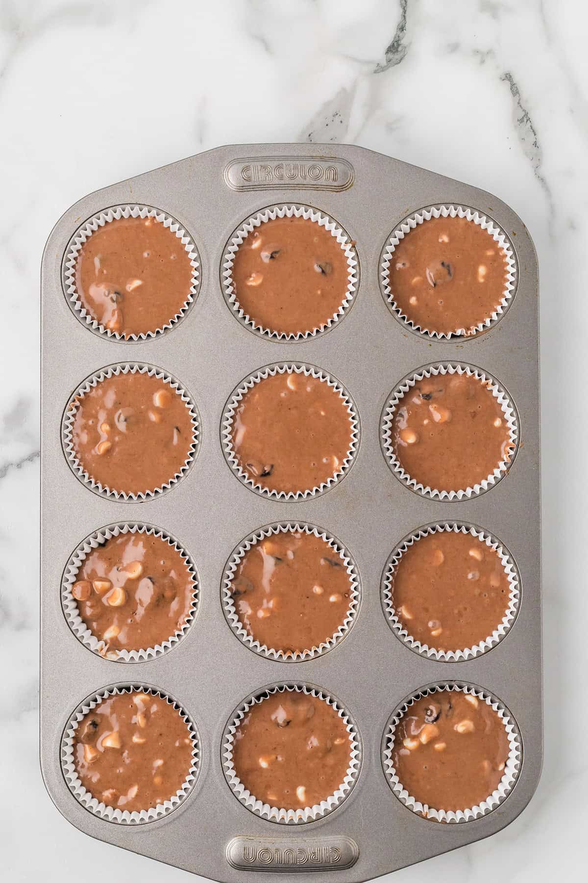 Batter poured into muffin cups.