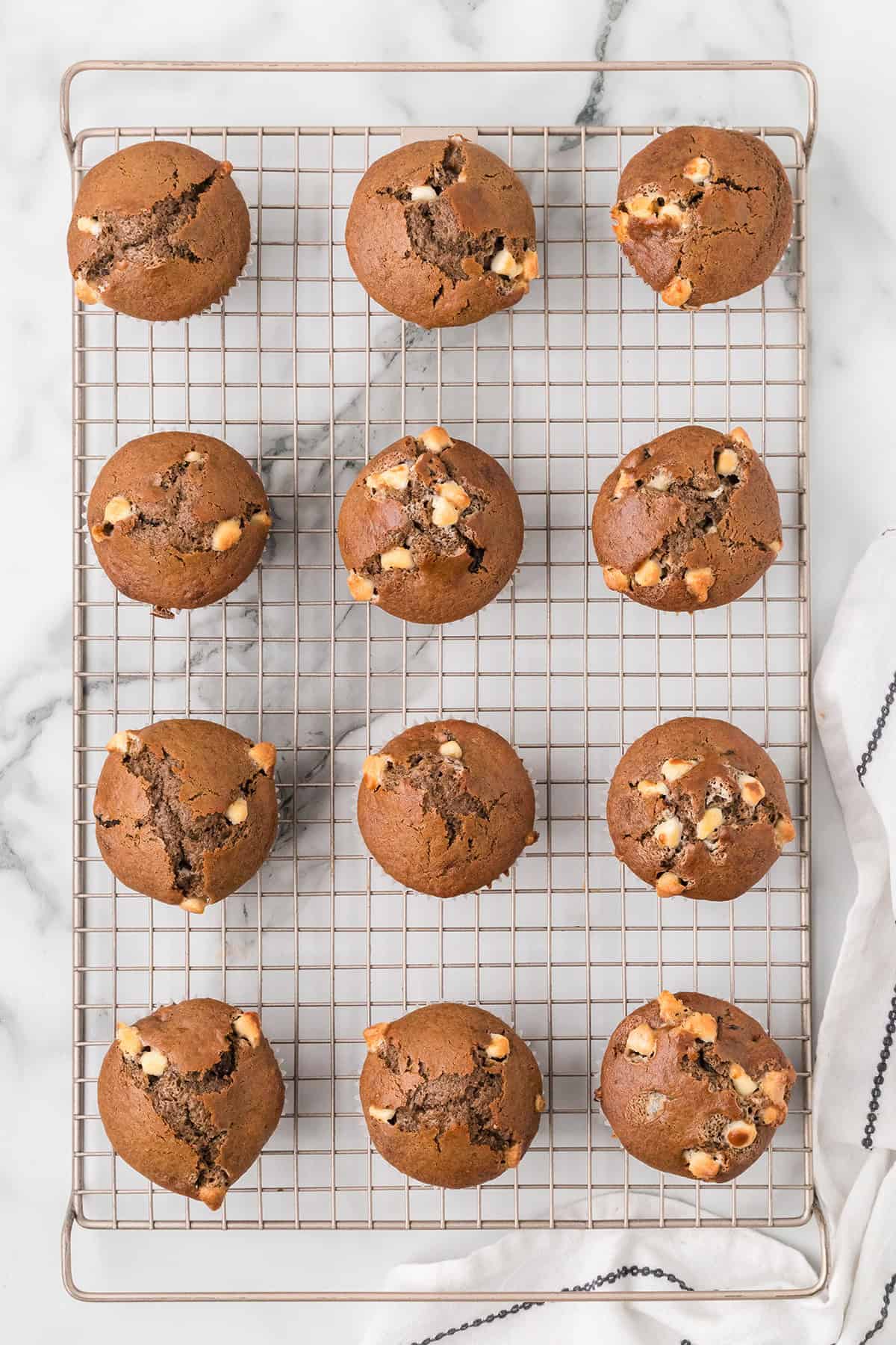 Muffins cooling on a wire rack.