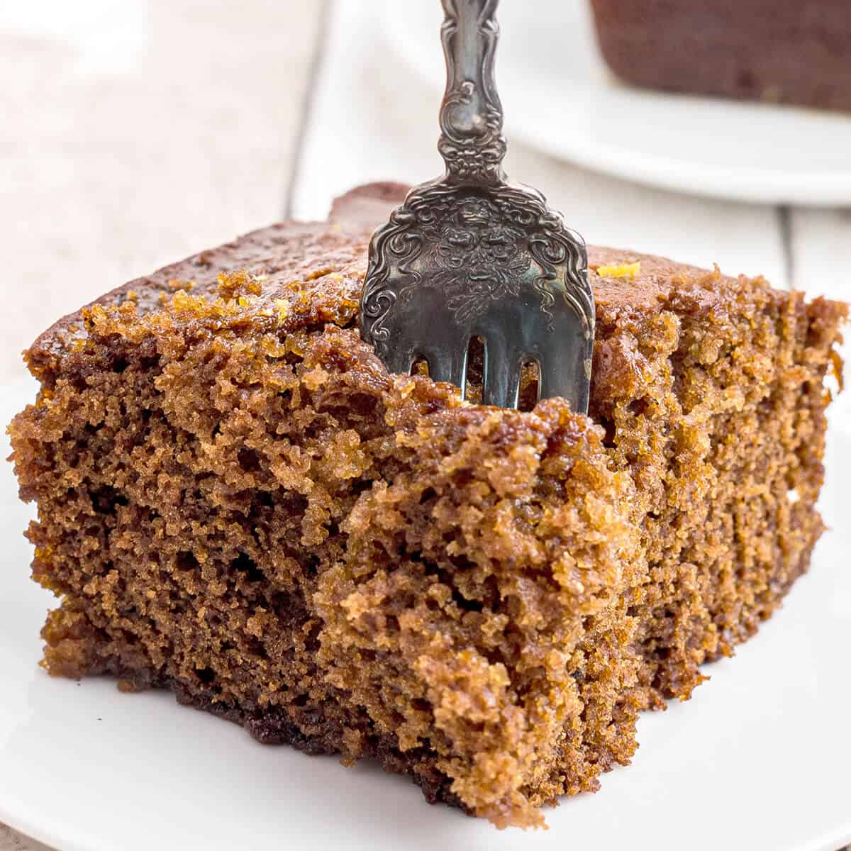 A serving of gingerbread with a vintage fork.