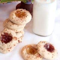 Thumbprint Jewels are tender, lemon-scented cookies, topped with nuts and their centers are filled with jam. From @Nevrenoughthyme https://www.lanascooking.com/thumbprint-jewels/