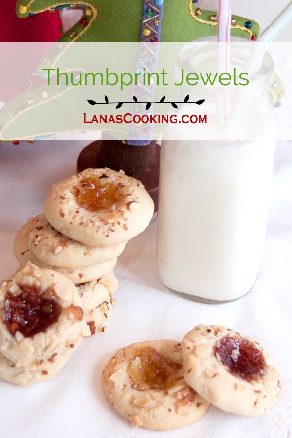 Thumbprint Jewels are tender, lemon-scented cookies, topped with nuts and their centers are filled with jam. From @Nevrenoughthyme https://www.lanascooking.com/thumbprint-jewels/