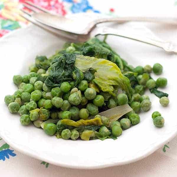 Peas with Lettuce - Fresh English peas cooked with chicken stock and tender young lettuce is a great early springtime side dish. https://www.lanascooking.com/peas-with-lettuce/