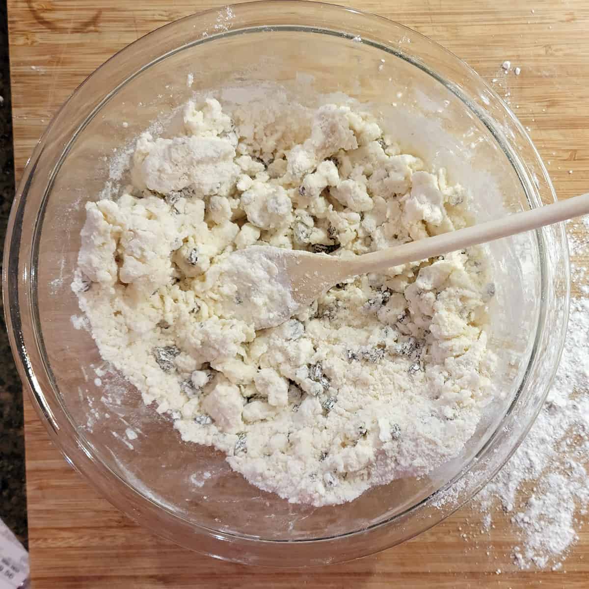 Cream added to mixture in bowl.