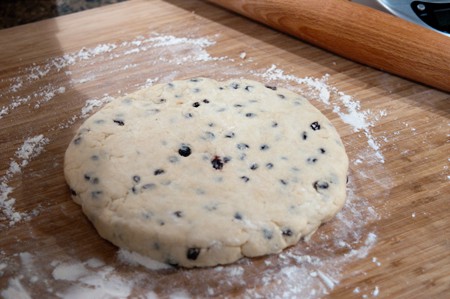 Scone dough rolled out on a floured board.