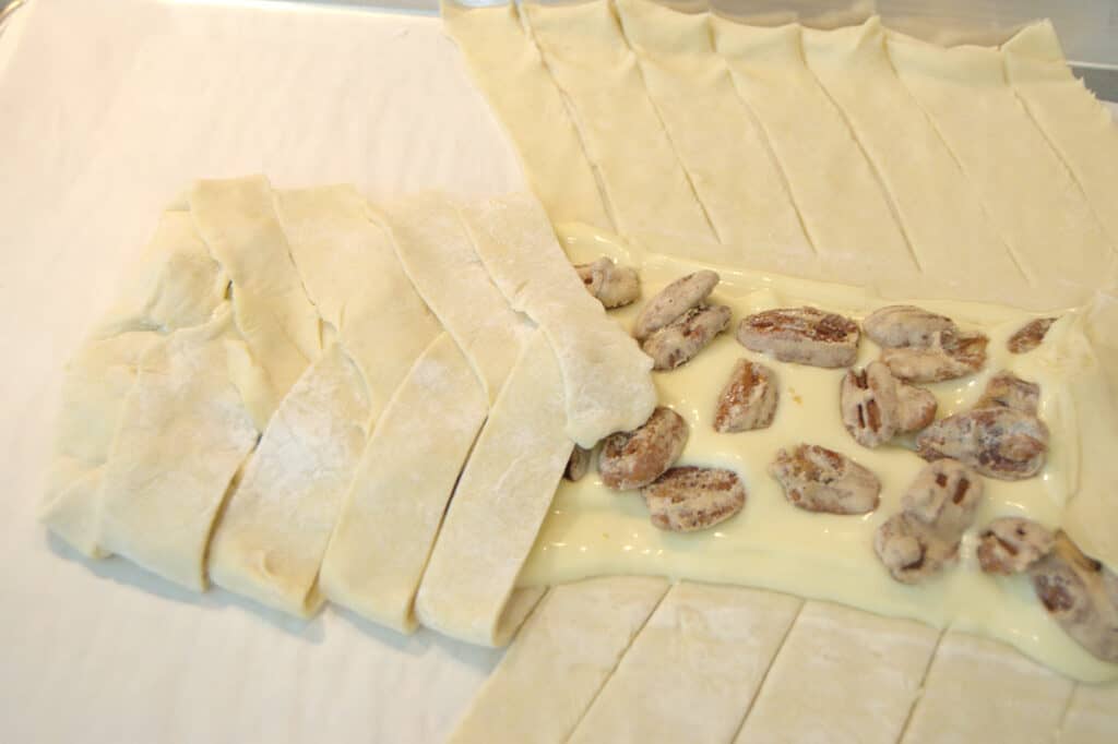 Braiding the puff pastry.
