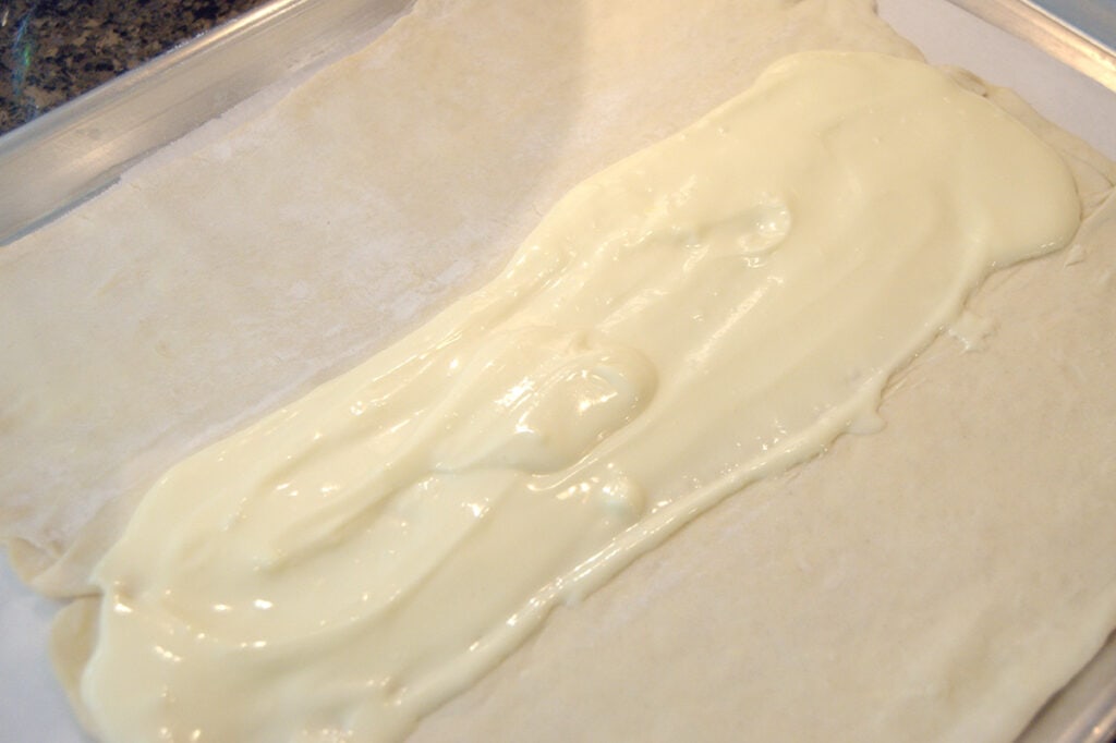 Cream cheese mixture spread over puff pastry.