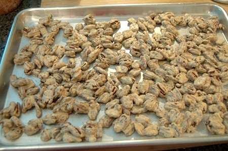 Finished pecans on a baking sheet.