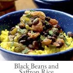 Black Beans with Saffron Rice - Black beans simmered with tomatoes and aromatic vegetables and served over fragrant saffron rice. https://www.lanascooking.com/black-beans-and-saffron-rice/