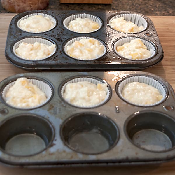 Muffin tins filled with batter.