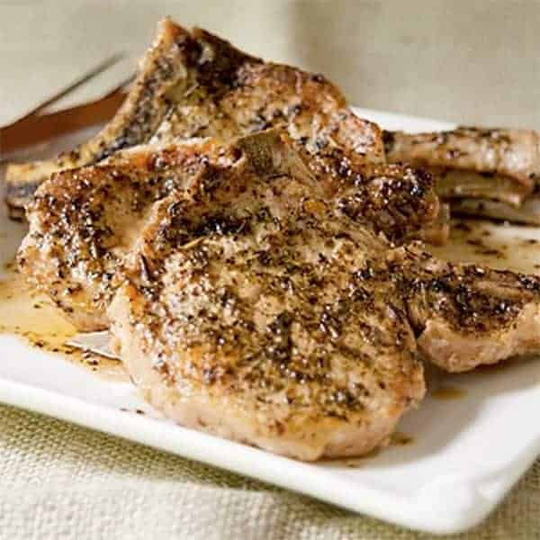 Savory pork chops seasoned with Italian herbs and braised on the stovetop. A quick dinner for busy summer days. https://www.lanascooking.com/savory-pork-chops/