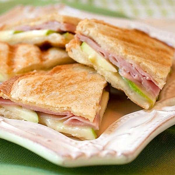 Ham Apple and Brie Panini - a lovely summer panini sandwich with good deli ham, crispy tart apple, creamy brie and the beautiful tang of Dijon mustard. https://www.lanascooking.com/ham-apple-and-brie-panini/