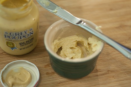 Dijon mustard and butter mix in a small ramekin.