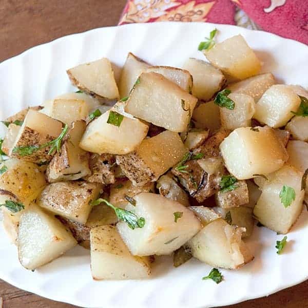 Roasted Potato Salad with Garlic and Rosemary tossed with dijon mustard and lemon juice. https://www.lanascooking.com/roasted-potato-salad/