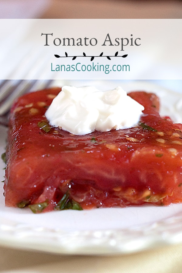Old fashioned Tomato Aspic with fresh tomatoes, celery, and parsley in gelatin. Serve your guests this most classic of recipes for a real treat. https://www.lanascooking.com/tomato-aspic/