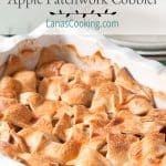 Apple Patchwork Cobbler in a baking dish with serving plates in the background. Text overlay for pinning.