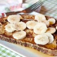 Banana Maple French Toast - whole grain French toast topped with sliced bananas and maple syrup. https://www.lanascooking.com/banana-maple-french-toast