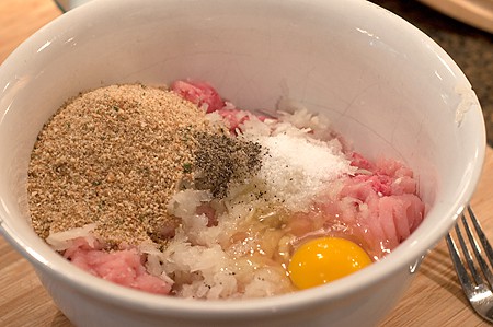 Egg, bread crumbs, and seasonings added to meat mixture.