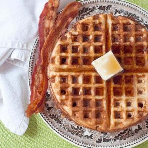 Whole Wheat Waffles - my classic recipe for healthier breakfast waffles. For variety, add fresh fruit or go savory with crumbled bacon and cheese. https://www.lanascooking.com/whole-wheat-waffles/