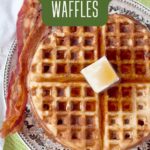 A plate with a whole wheat waffle topped with butter and syrup, served with two strips of bacon; text reads Easy Whole Wheat Waffles.