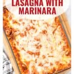 A baked homemade lasagna in a glass dish with melted cheese, labeled Homemade Lasagna With Marinara.