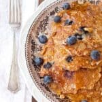 These hearty Oatmeal Blueberry Pancakes are packed full of whole grain oatmeal, blueberry, orange zest, and pecans. https://www.lanascooking.com/oatmeal-blueberry-pancakes/