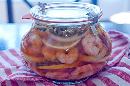 Shrimp and ingredients in a sealed jar.
