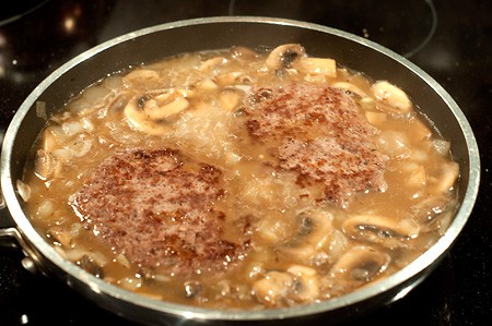 Beef patties returned to the pan with the gravy.