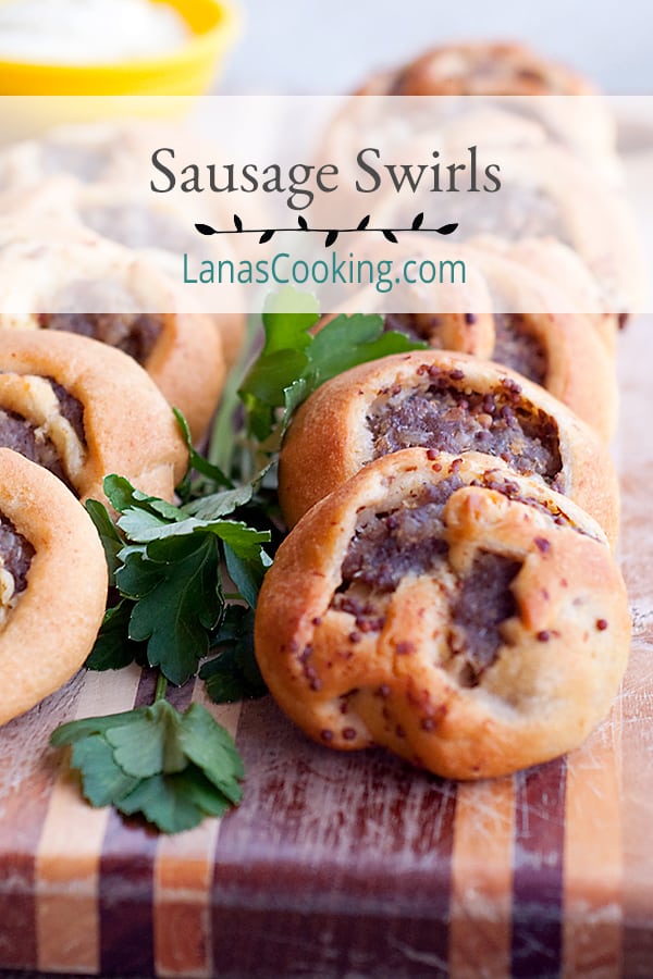 These Sausage Swirls use purchased crescent roll dough spread with mustard and sausage to make a fantastic appetizer for any occasion. https://www.lanascooking.com/sausage-swirls/