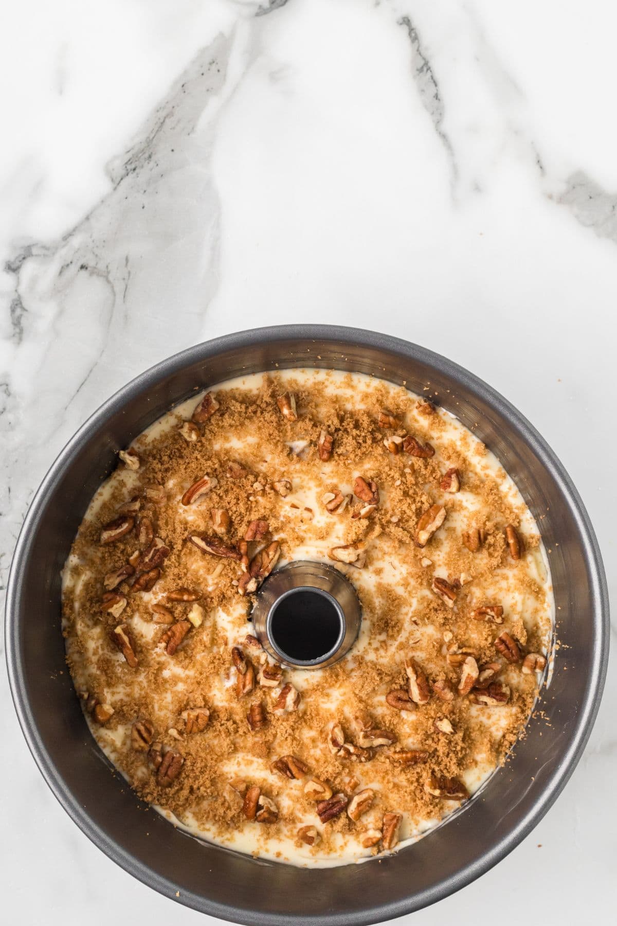 The remaining pecan and brown sugar mixture spread over the last layer of batter.