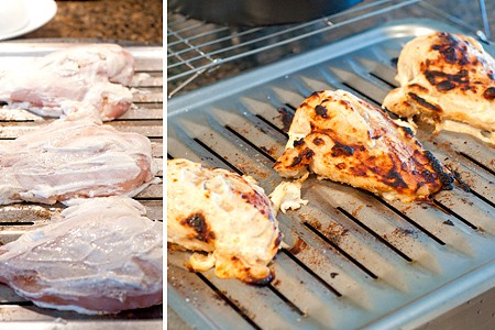 Chicken breasts on a broiler pan.