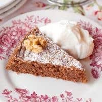 Flourless Walnut Cake - this flourless cake uses ground walnuts in place of flour and beaten egg whites for lift and is flavored with chocolate and coffee. https://www.lanascooking.com/flourless-walnut-cake/