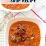A bowl of tomato fennel soup topped with croutons, next to a spoon on a plaid cloth, recipe text overlay.