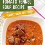Bowl of tomato fennel soup with croutons on top, labeled as a perfect snow day lunch.