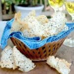 Asiago Cheese Crisps - Crispy chips of baked asiago cheese, minced sage, and chopped pine nuts. https://www.lanascooking.com/asiago-cheese-crisps/
