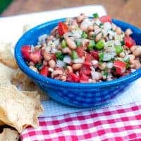 Texas caviar combines black-eyed peas, tomatoes, peppers, onions, and cilantro for a light yet substantial summer dip or salad. Serve with tortilla chips. https://www.lanascooking.com/texas-caviar/