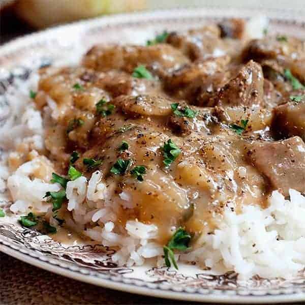 Creamy Steak and Mushrooms - steak tips in a creamy mushroom sauce served over rice. Quick and easy family dinner! https://www.lanascooking.com/creamy-steak-and-mushrooms