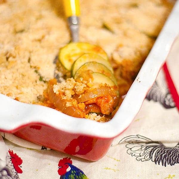 This Baked Zucchini with Bacon is a great way to use the abundant supply of summer zucchini - in a casserole with bacon, tomato sauce, and onion. https://www.lanascooking.com/baked-zucchini-with-bacon/