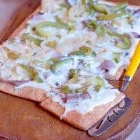 Cheesesteak Pizza - a quick and easy cheesesteak style pizza with a convenient refrigerated pizza crust and roast beef from the deli. https://www.lanascooking.com/cheesesteak-pizza/
