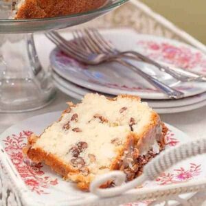 This White Chocolate Cake is a delicious, decadent, comfort food cake rich with butter and full of white chocolate, pecans, and coconut. https://www.lanascooking.com/white-chocolate-cake/