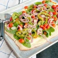 Roasted Veggie Pizza - a classic pizza crust topped with ricotta and roasted vegetables. Quick and easy Friday night dinner! https://www.lanascooking.com/roasted-veggie-pizza/