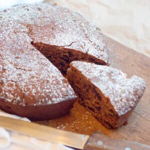 Irish spiced fruitcake dusted with sugar and cut into wedges.