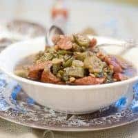 Lentil and Sausage Gumbo Soup - Lentils take the place of a second protein in this deliciously flavored soup based on traditional Louisiana-style gumbo. https://www.lanascooking.com/lentil-sausage-gumbo-soup/