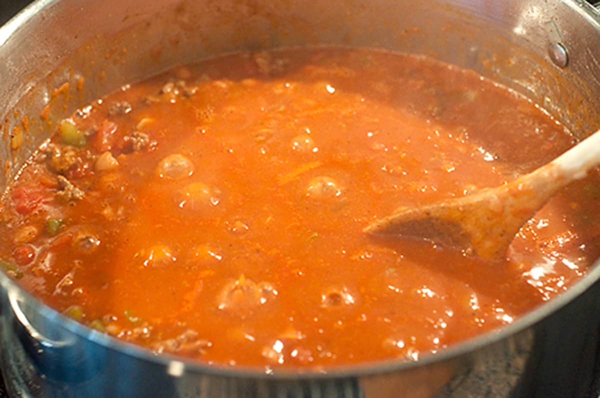 Chili simmering in a deep skillet.