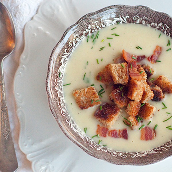 Leek and potato soup in a serving bowl.