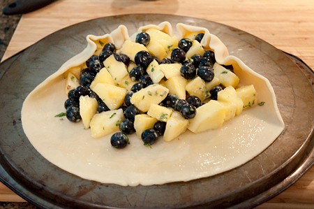Photo showing how to form the galette edge by folding up over the fruit filling.