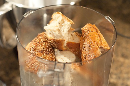 Chunks of bread in a food processor.