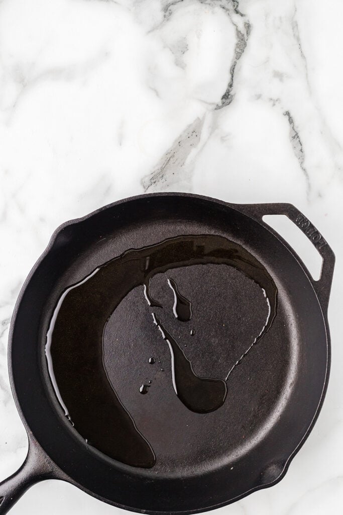 Oil in a cast iron skillet.