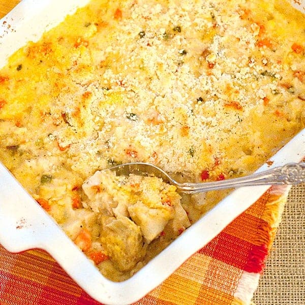 This Chicken Artichoke Casserole combines cooked chicken with veggies, rice, and cheese for a delicious one-dish supper. https://www.lanascooking.com/chicken-artichoke-casserole/