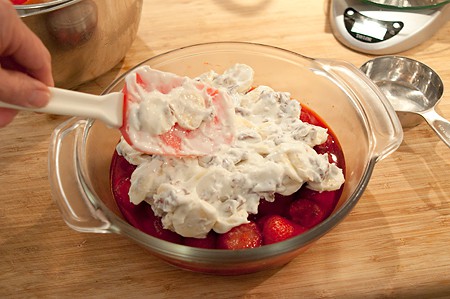 Banana and sour cream layer added over strawberries.
